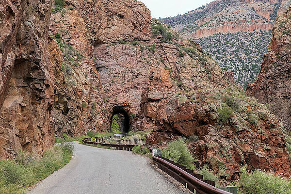 Sky Wall Art featuring the photograph Red Rock Tunnel by Steve Templeton