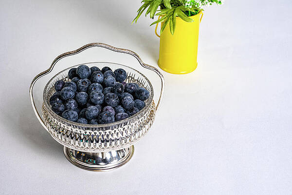 Artificial Light Wall Art featuring the photograph Ripe Blueberries In Silver Bowl by Charles Floyd