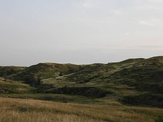 Sky Photograph - Rolling Badlands by Amanda R Wright