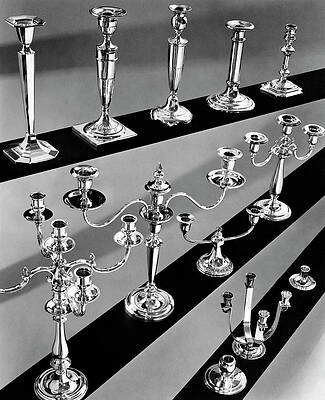 Candle Wall Art featuring the photograph Rows Of Silver Candlesticks And Candelabras by Peter Nyholm