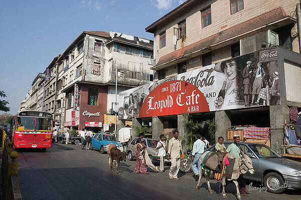 Wall Art featuring the photograph Rural Family At Leopold Cafe, Mumbai by Sanjay Marathe