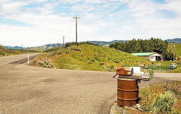 Wall Art featuring the photograph Rusty Mail Box And Wind Turbines by Tom Cochran