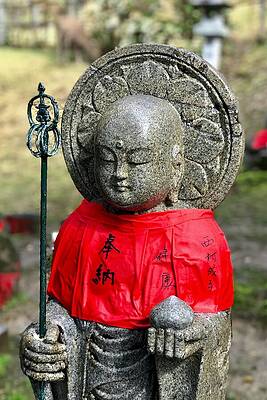 Serene Wall Art featuring the photograph Serene Statue In Nara's Tranquil Garden by Travel Essayist