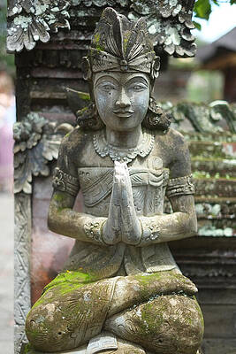 Serene Wall Art featuring the photograph Serene Stone Figure In Garden by Travel Essayist