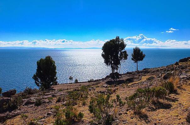 Serene Wall Art featuring the photograph Shores Of Lake Titicaca In Peru by Travel Essayist