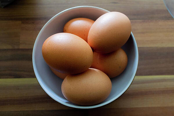 Raw Photograph - Six Eggs Stacked In A White Bowl by Scott Lyons