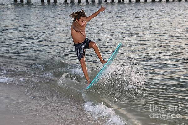 Skimboarding Trick at Sunset Photograph