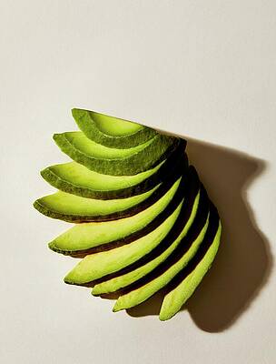 Avocado Photograph - Sliced Avocados by Isabel Zapata