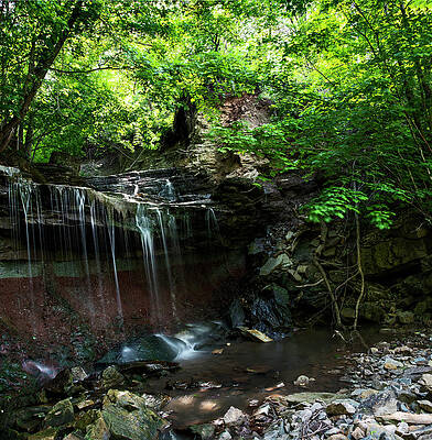 Majestic Photograph - Small Waterfall Cascading Into A Pool Below by John Twynam