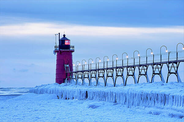Snow-Covered Lighthouse in Winter Photograph