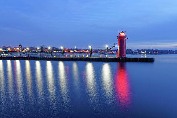 Photograph - South Haven South Pier Light Reflections by Michael Collins