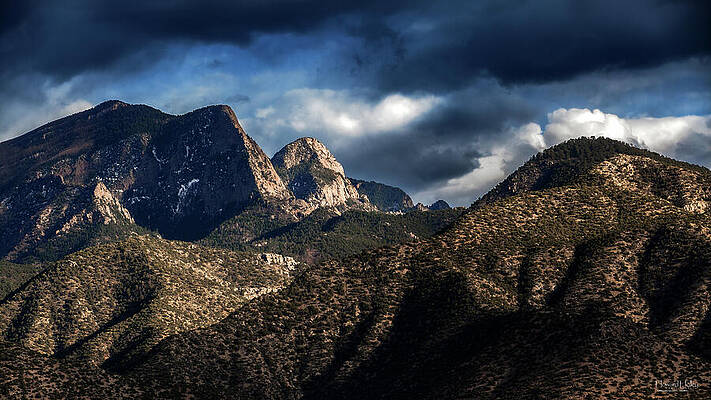 Sky Wall Art featuring the photograph Storm Brewing Over The Sandia Mountains. by Howard Holley