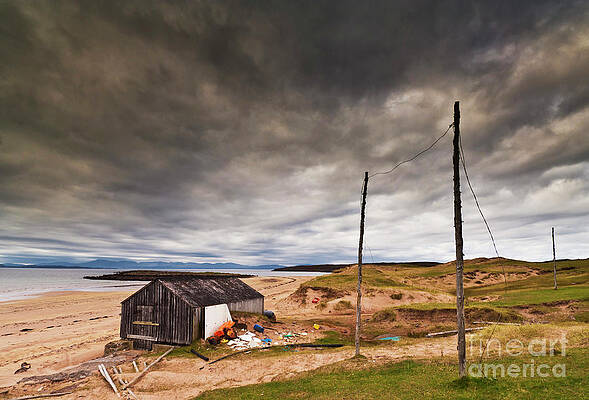 Dramatic Photograph - Stormy Sky And Abandoned Fishing Hut, Red Point Beach, Wester Ross, Scotland by Neale And Judith Clark