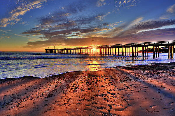 Sunset at Pier with Glowing Sand Photograph
