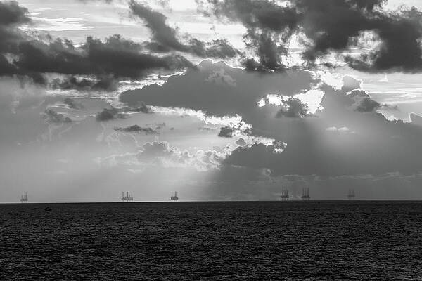 Sunset Photograph - Sunrise And Oil Rig Platforms by Steve Templeton