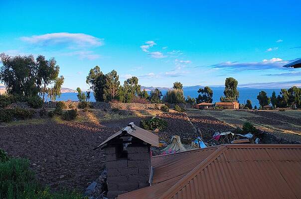 Serene Wall Art featuring the photograph Sunrise Over Lake Titicaca by Travel Essayist