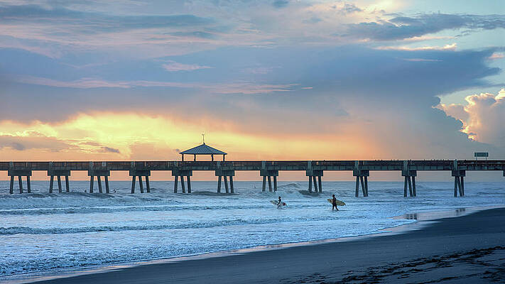 Moody Wall Art featuring the photograph Sunrise Pier And Surfers by Laura Fasulo