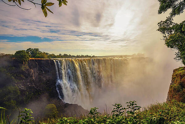 Sunrise Wall Art featuring the photograph Sunset At The Victoria Falls On Zambezi River In Zimbabwe by Miroslav Liska