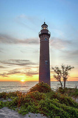 Sunset Behind a Coastal Lighthouse Wall Art