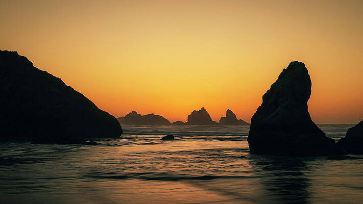 Sunset Over Rocky Coastline Wall Art