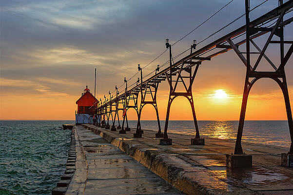 Sunset Over Pier and Lighthouse Photograph
