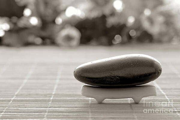 Wall Art featuring the photograph Symbolic Zen Inspired Stone In A Spa by Olivier Le Queinec