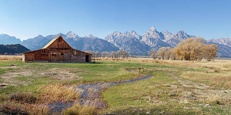 Rustic Barn with Mountain Backdrop Photograph
