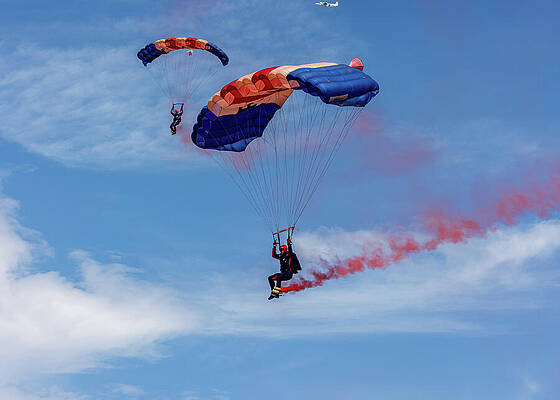 Daring Parachute Display in the Sky Photograph