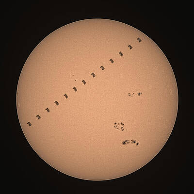Space Wall Art featuring the photograph The International Space Station Crossing In Front Of The Sun by Brian Weber