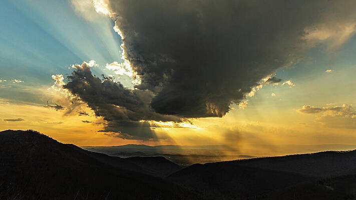 Dramatic Sunset Over Mountain Range Photograph