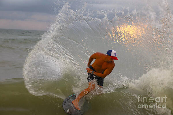 Surfer Riding a Wave at Sunset Wall Art