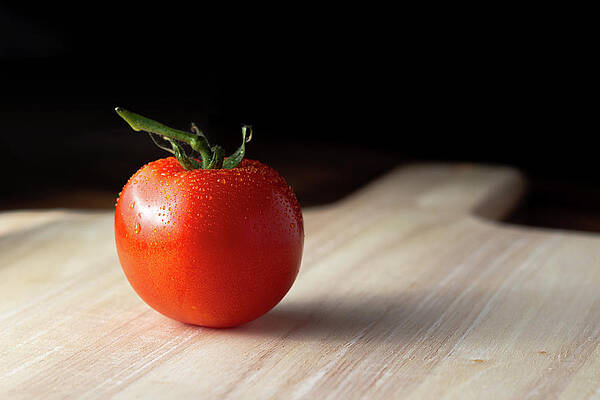 Raw Photograph - Tomato On A Wooden Board by Scott Lyons