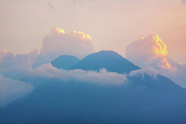 Serene Photograph - Top Volcanoes Silhouettes Framed By Clouds by Tatiana Travelways