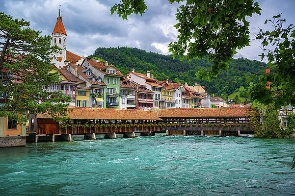 Wall Art featuring the photograph Traditional Covered Wooden Bridge Spanning The Aare River In Thun, Switzerland by Miroslav Liska