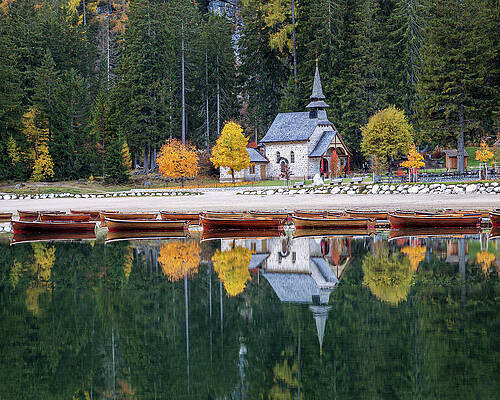 Tranquil Lakeside Chapel in Autumn by Elvira Peretsman