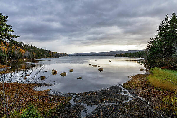 Peaceful Lake Under Cloudy Skies Photograph