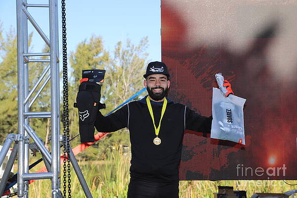 Triumphant Athlete at Outdoor Event Photograph