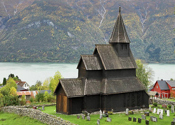 Wall Art featuring the photograph Urnes Stavkyrkje And Lustrafjorden by Nicholas Blackwell