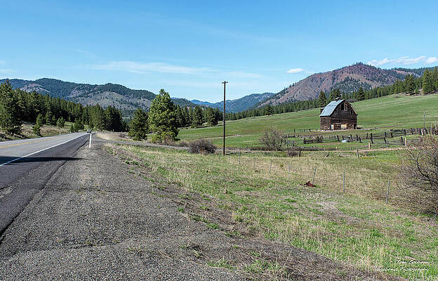 Rustic Barn in Mountainous Countryside Wall Art