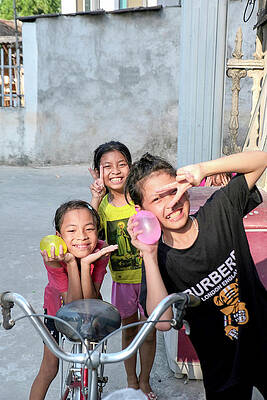 Happy Wall Art featuring the photograph VietKids1 by Ed Wilkerson