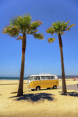 Vintage Wall Art featuring the photograph Vintage Yellow Volkswagen Camper Van Parked Between Palm Trees On A Sandy Beach by Miroslav Liska