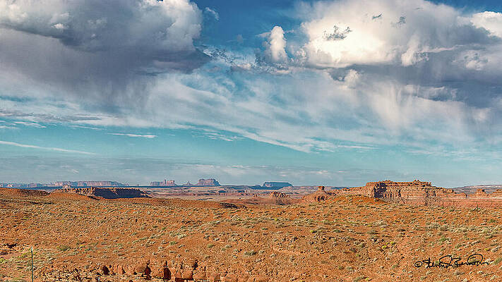Expansive Desert Landscape Under Clouds Photograph