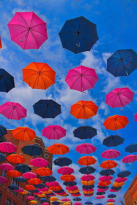 Wall Art featuring the photograph Wausau's Umbrellas Under Blue Sky by Dale Kauzlaric