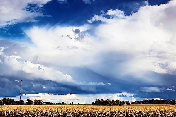 Serene Wall Art featuring the photograph Weather's Embrace Dramatic Skies Over Serene Fields by Travel Essayist
