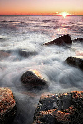 Maine Wall Art featuring the photograph Wet Rocks In The Surf At Sunrise. by Jeff Sinon