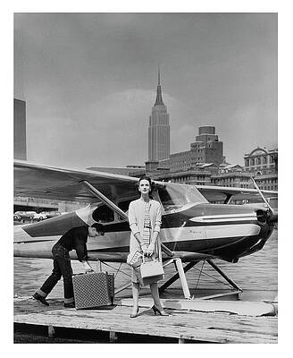 Wall Art featuring the photograph Woman By A Seaplane by John Rawlings