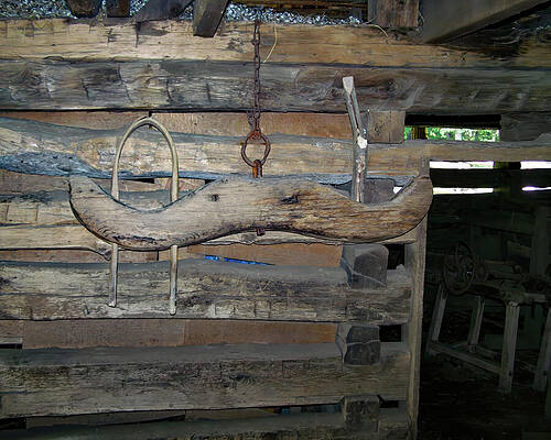 Wall Art featuring the photograph Wooden Yoke Hanging In A Barn by Flees Photos