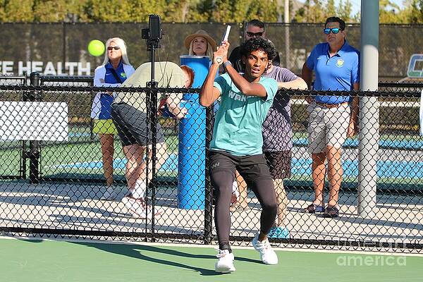 Young Athlete on Tennis Court Photograph