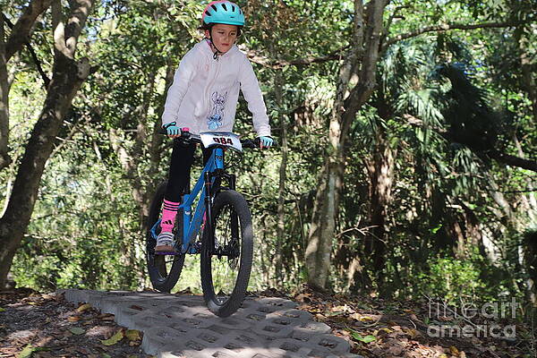 Young Cyclist in a Forest Trail Wall Art