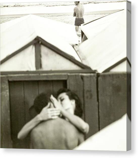 Couple Kissing By A Model Wearing Westwood Trunks Canvas Art Print by Chadwick Hall
